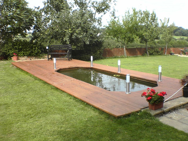 formal-rectangular-koi-pool-with-timber-decking-surround-northamptonshire-uk